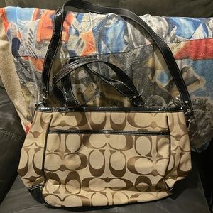 Brown coach shoulder bag never used at all .